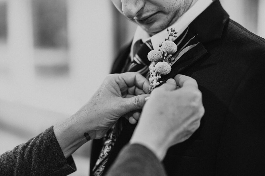 Boutonniere being pinned