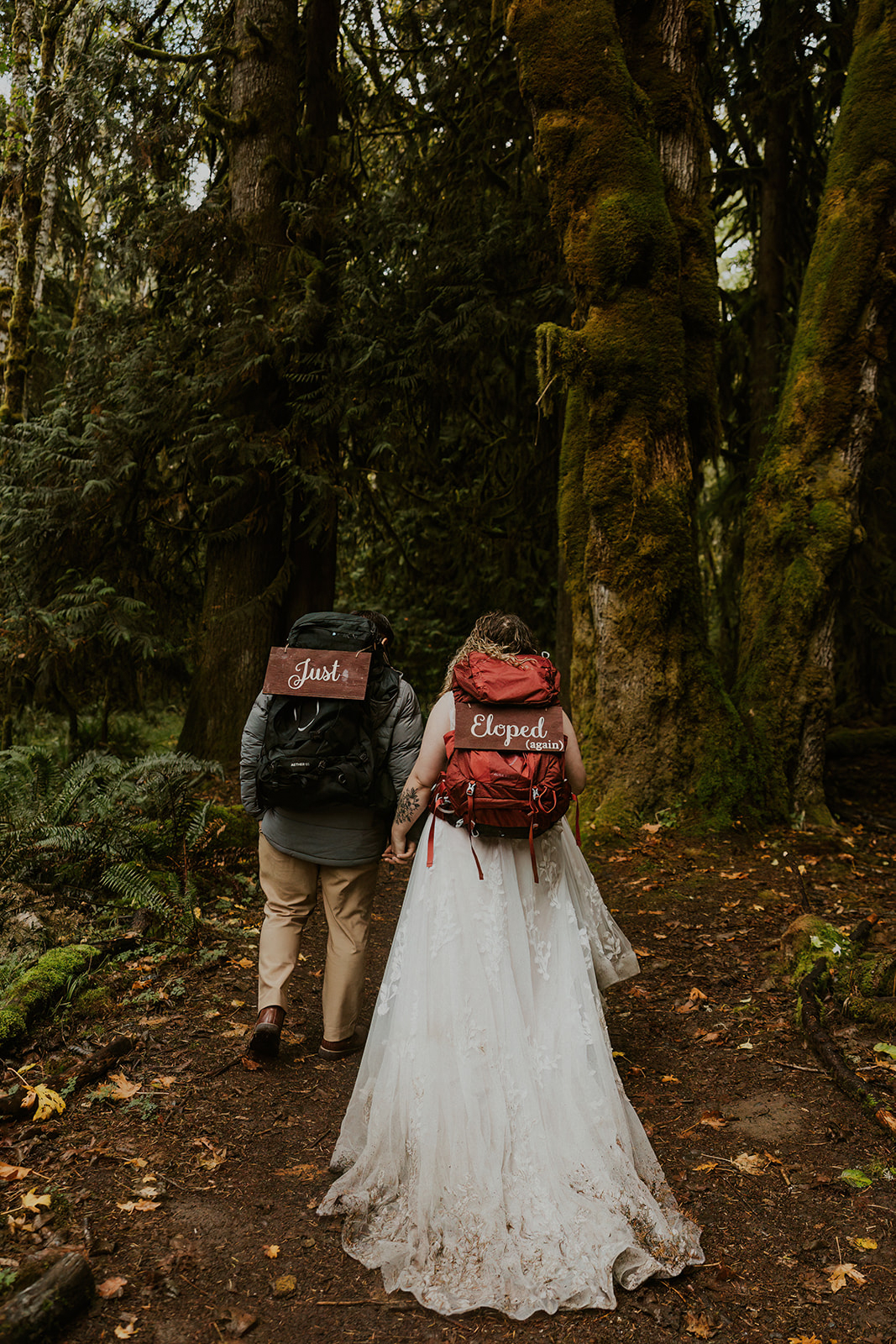 Olympic National Park elopement, backpacks with "just eloped" signs
