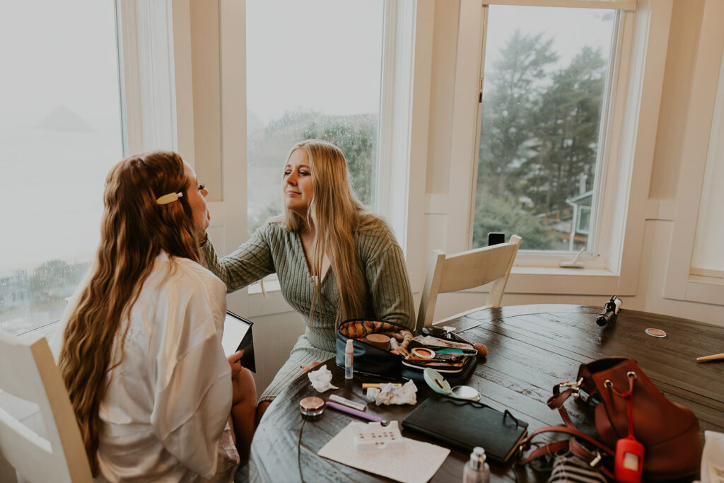 Mom helping daughter get ready for wedding