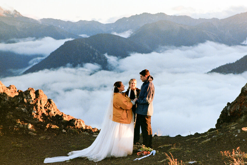 A couple in wedding attire have a wedding ceremony at Hurricane Ridge in Olympic National Park on 35mm film