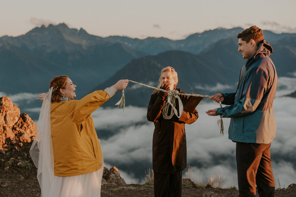 A couple in wedding attire have a wedding ceremony at Hurricane Ridge in Olympic National Park