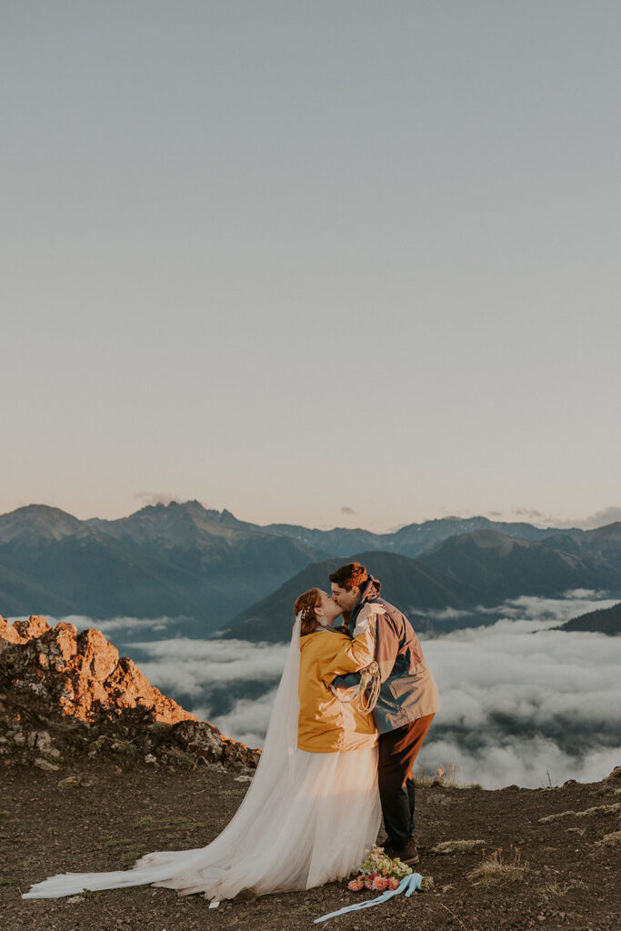 A couple in wedding attire have a wedding ceremony at Hurricane Ridge in Olympic National Park