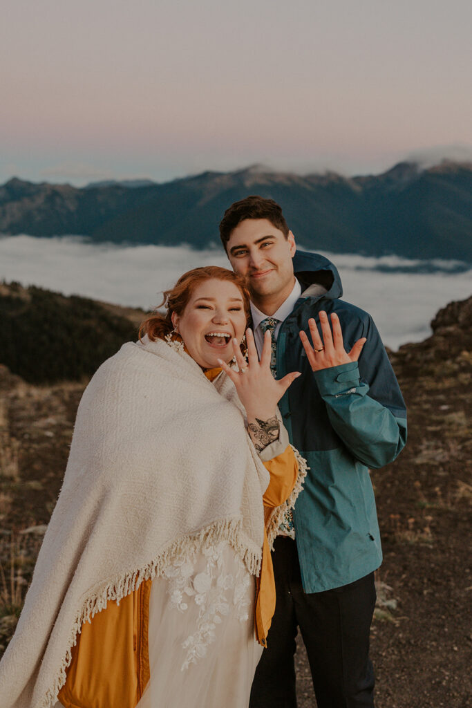 A couple in wedding attire poses for portraits at Hurricane Ridge in Olympic National Park