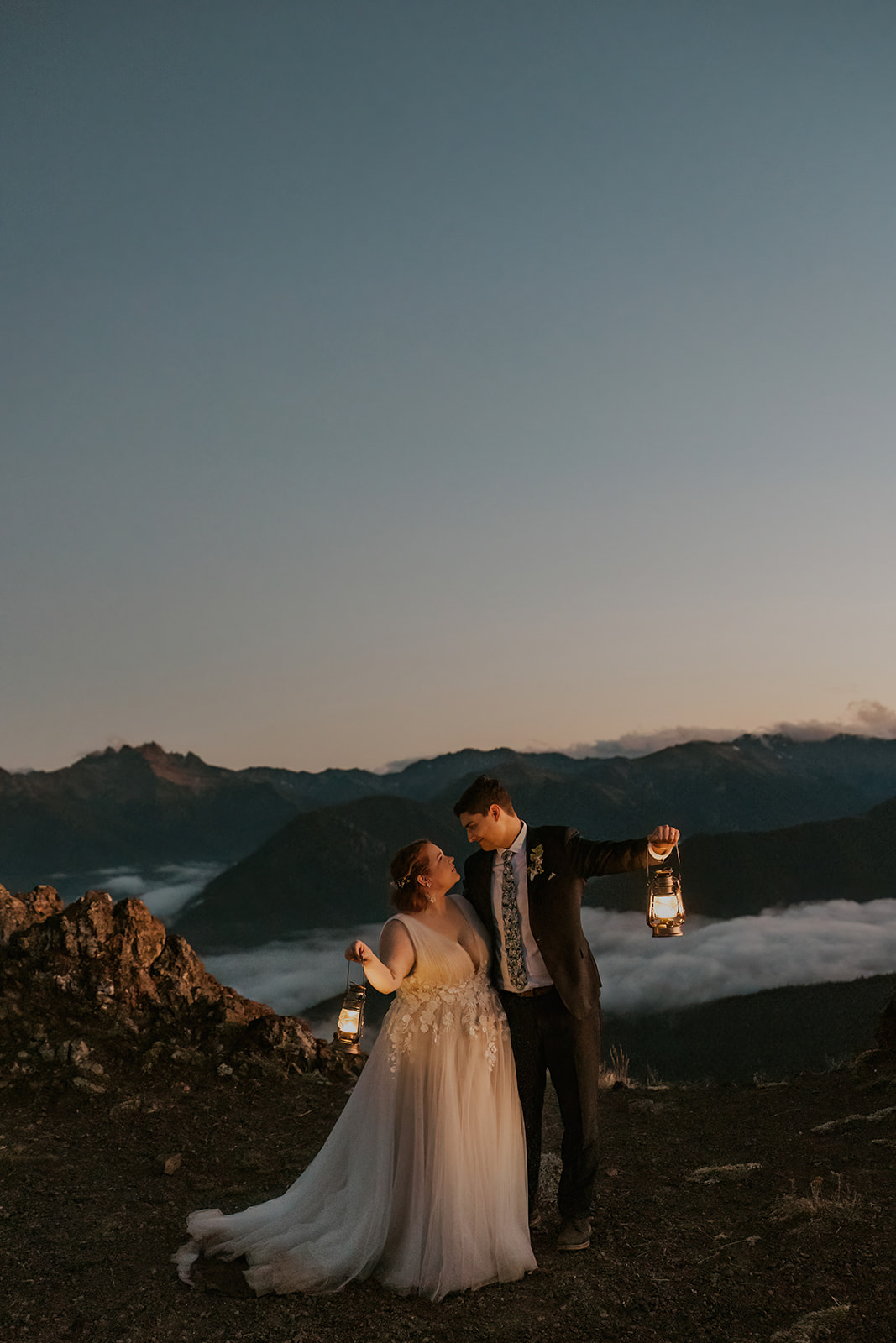 A couple in wedding attire poses for portraits at Hurricane Ridge in Olympic National Park