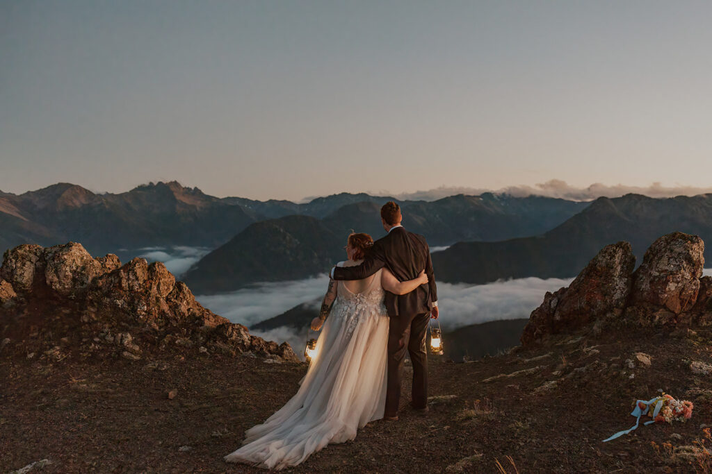 A couple in wedding attire poses for portraits at Hurricane Ridge in Olympic National Park