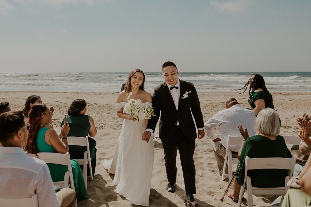 Couple walking down the aisle during their micro wedding on the Oregon Coast