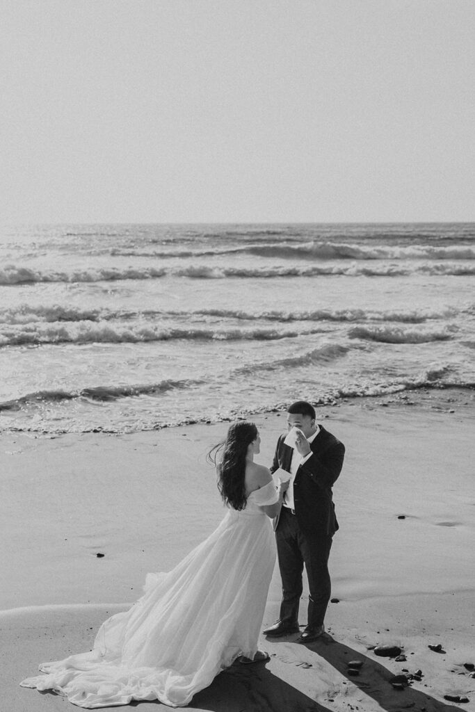 Couple exchanging vows during their elopement day on the Oregon Coast