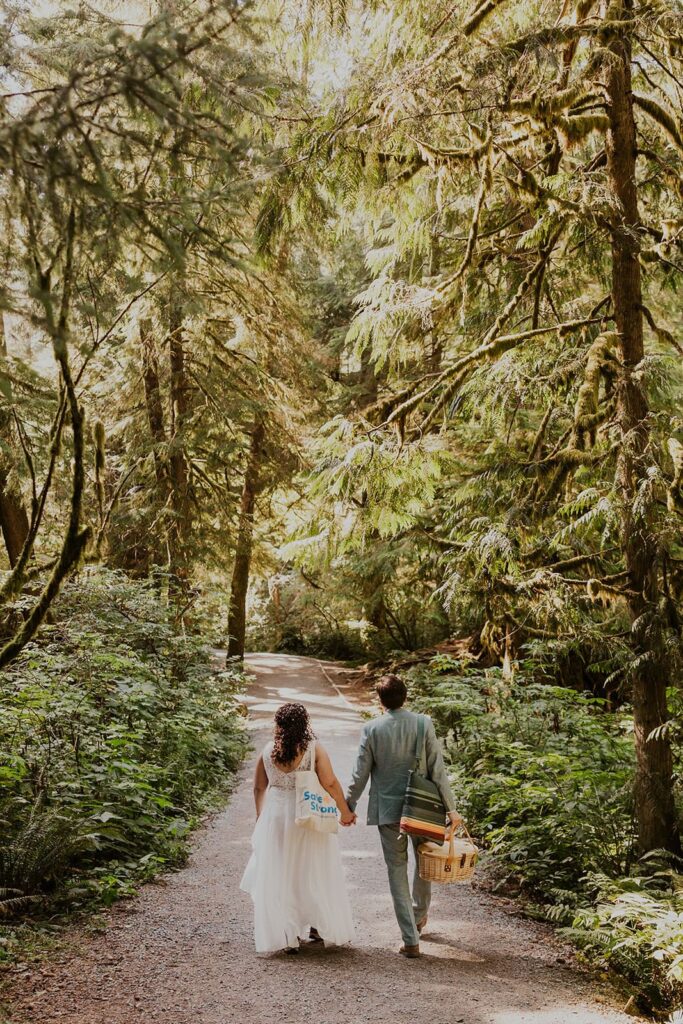 A couple hiking to Short Sand Beach on the Oregon Coast during their elopement day