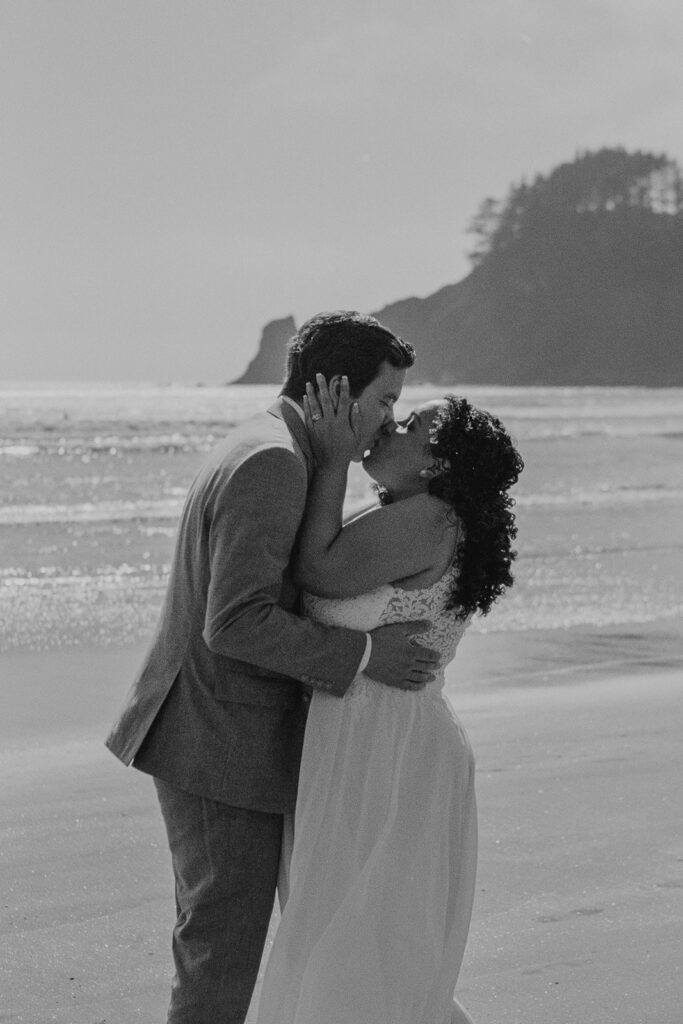 A couple exchanging vows at Short Sand Beach on the Oregon Coast during their elopement day on 35mm film