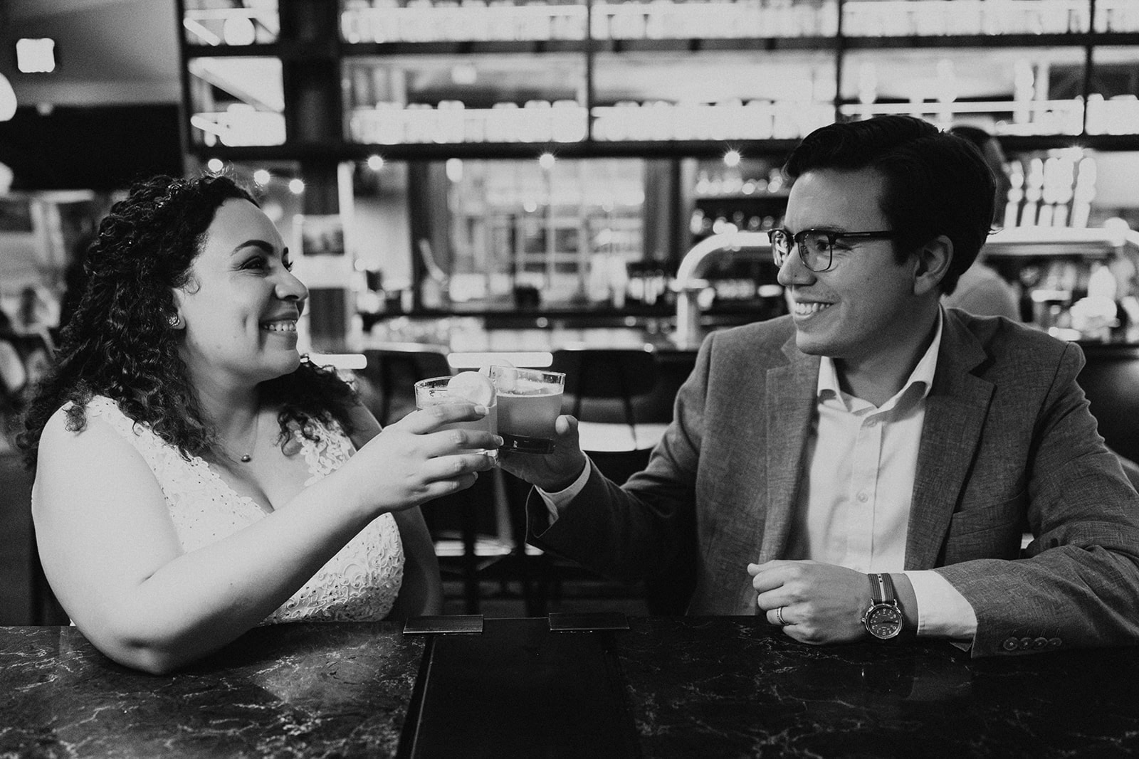 A couple having drinks together at Pelican Brewing in Cannon Beach during their elopement day