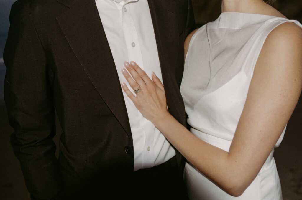 Details of a couple's wedding attire during their Oregon Coast elopement on 35mm film