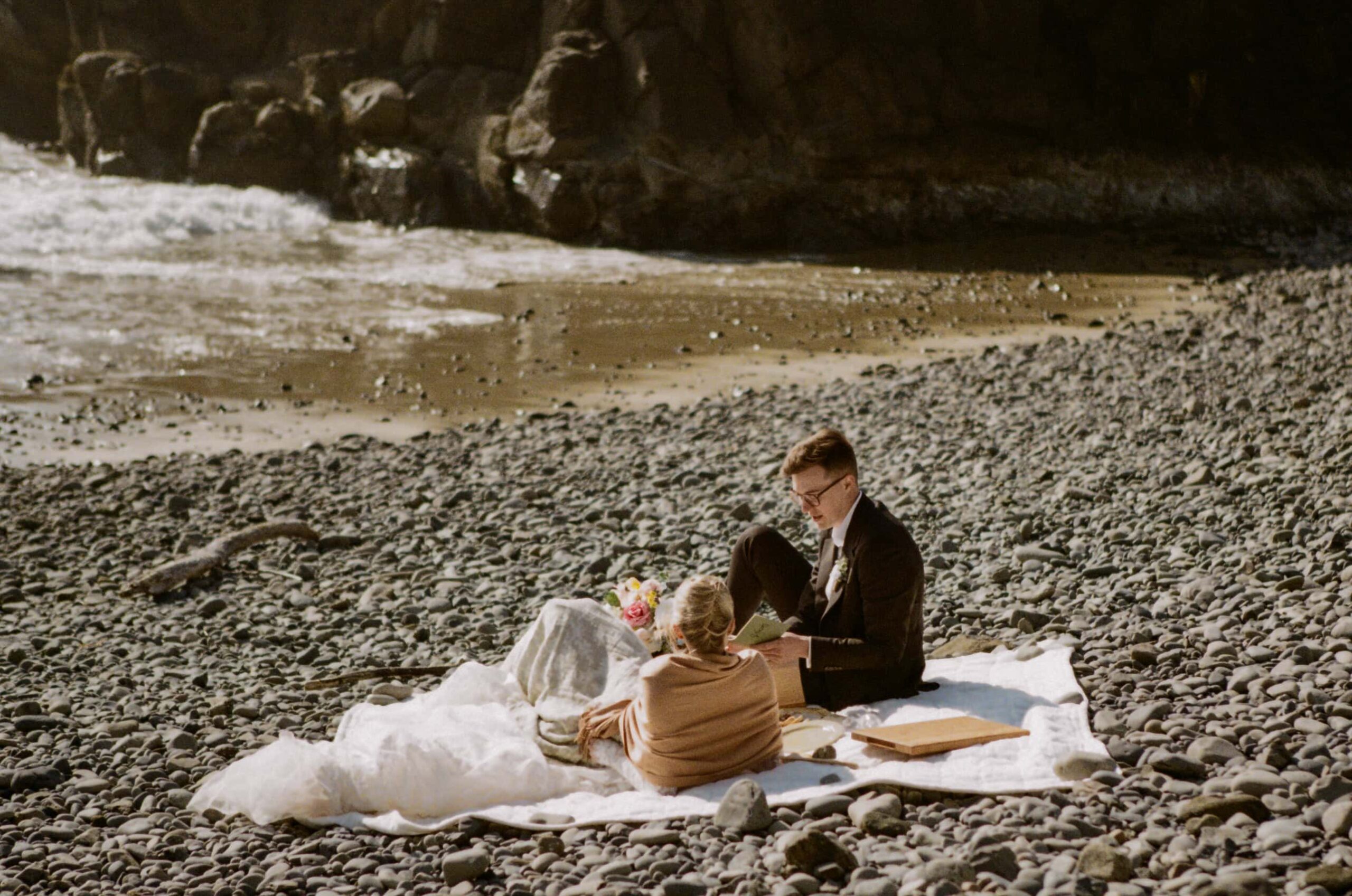A couple exchange vows on an Oregon Coast beach during their elopement day on 35mm film