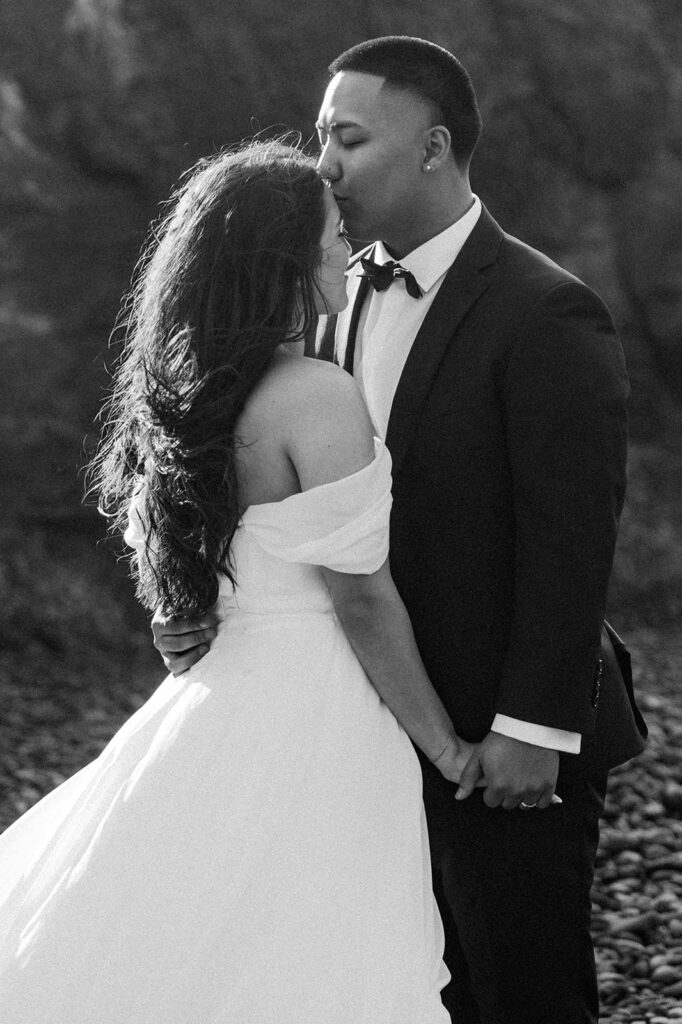 A couple on an Oregon Coast beach during their elopement
