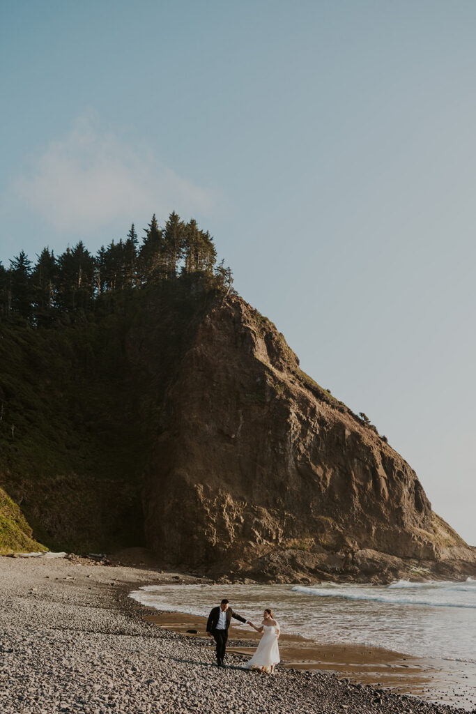 A couple on an Oregon Coast beach during their elopement